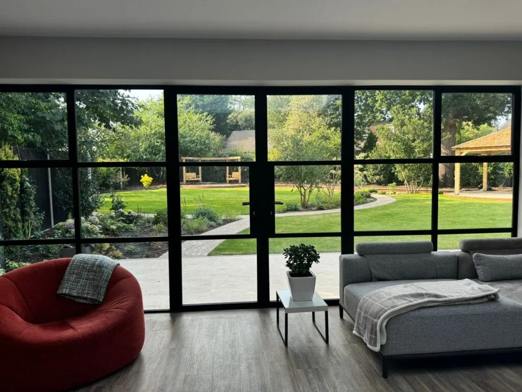 The actual view from inside the house. The juxta position of the square windows against the curve working beautifully.